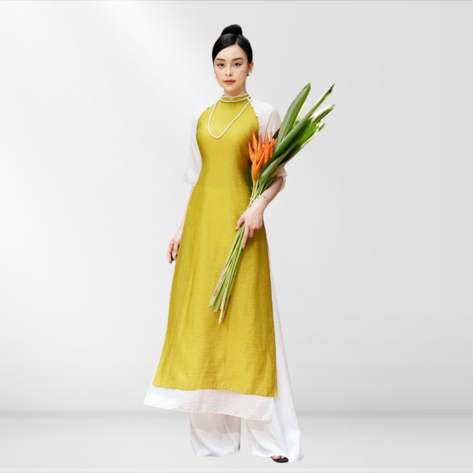 Mẫu đồng phục lễ tân khách sạn áo dài vàng trắng